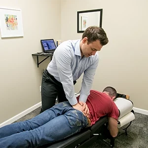 Chiropractor Warsaw IN Matthew Palladino Adjusting Patient